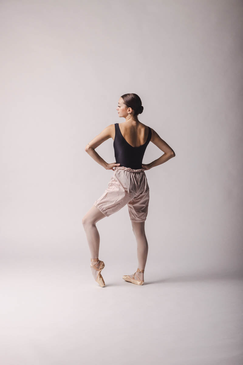 Claire Leotard, Color: Black Features a sleek and contouring design, a velour bust panel and boat neck, V-back and a tank silhouette. By worldwide Ballet, back view