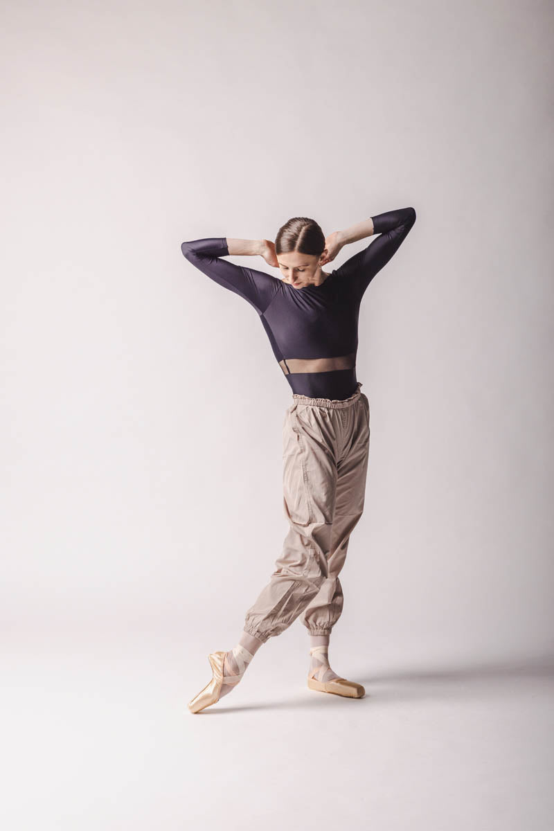Elle is wearing Beige Trashbag Pants, perfect warm up pants, By worldwide Ballet