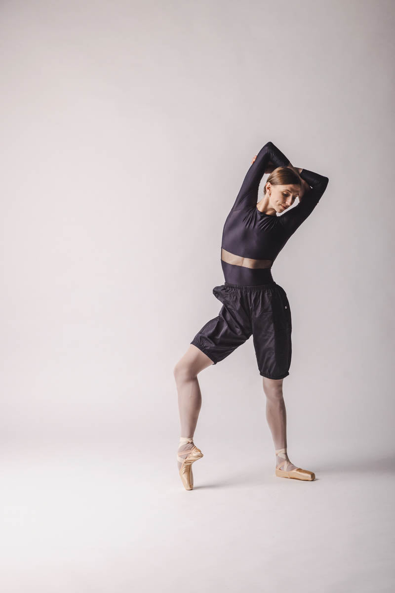 The dancer is wearing shorts trashbag pants in Black, by worldwide ballet