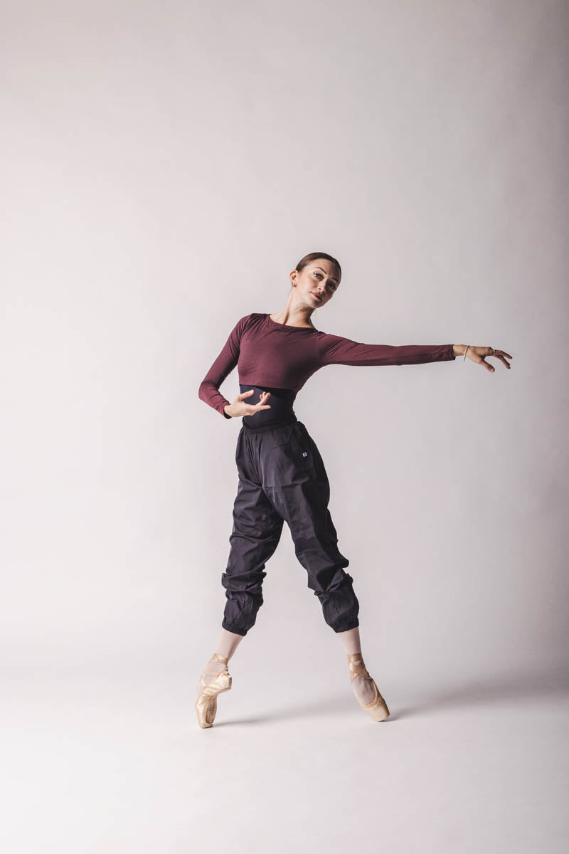 The dancer is wearing Crop Top color: Burgundy By worldwide Ballet