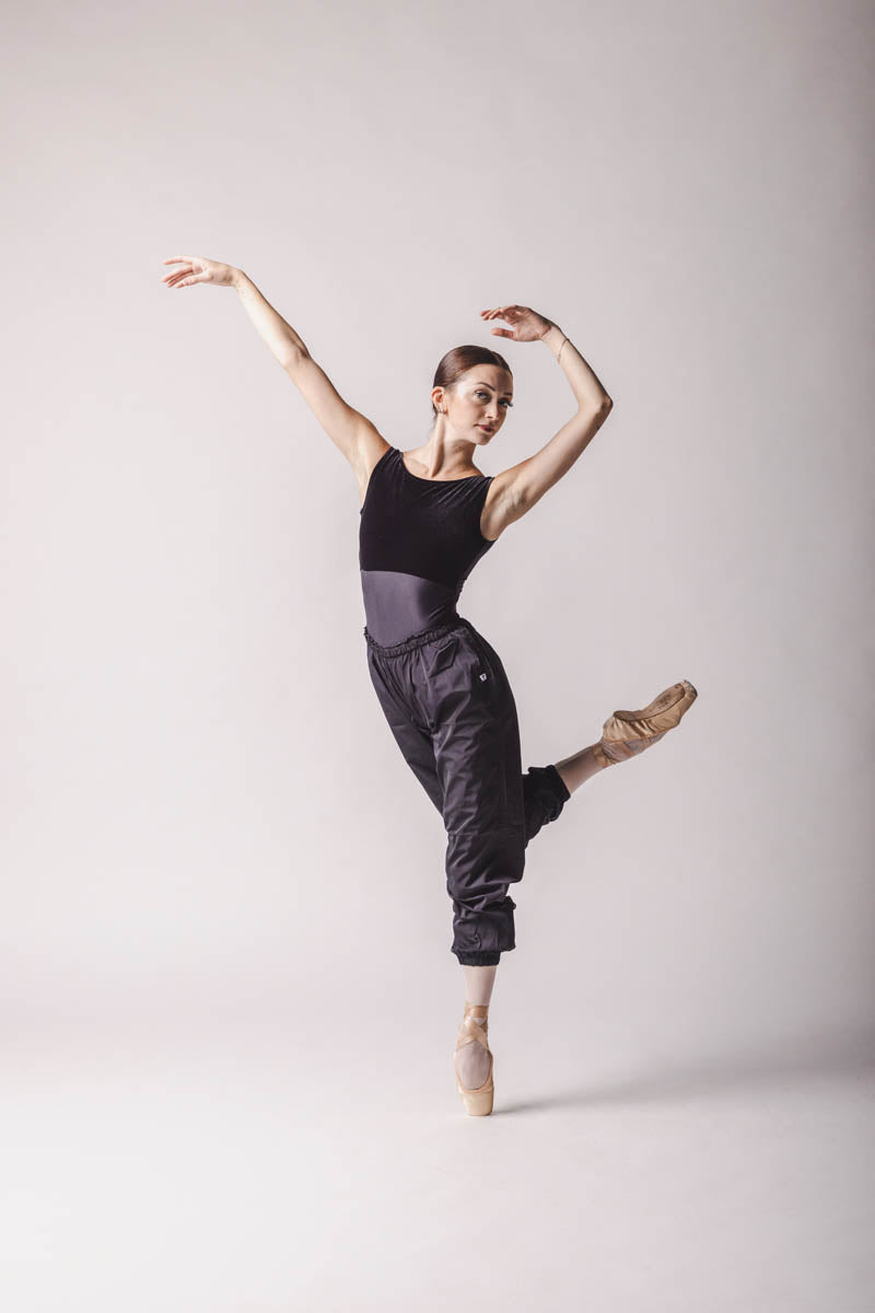 The dancer is wearing Black Trashbag pants, perfect warm up pants, by worldwide ballet