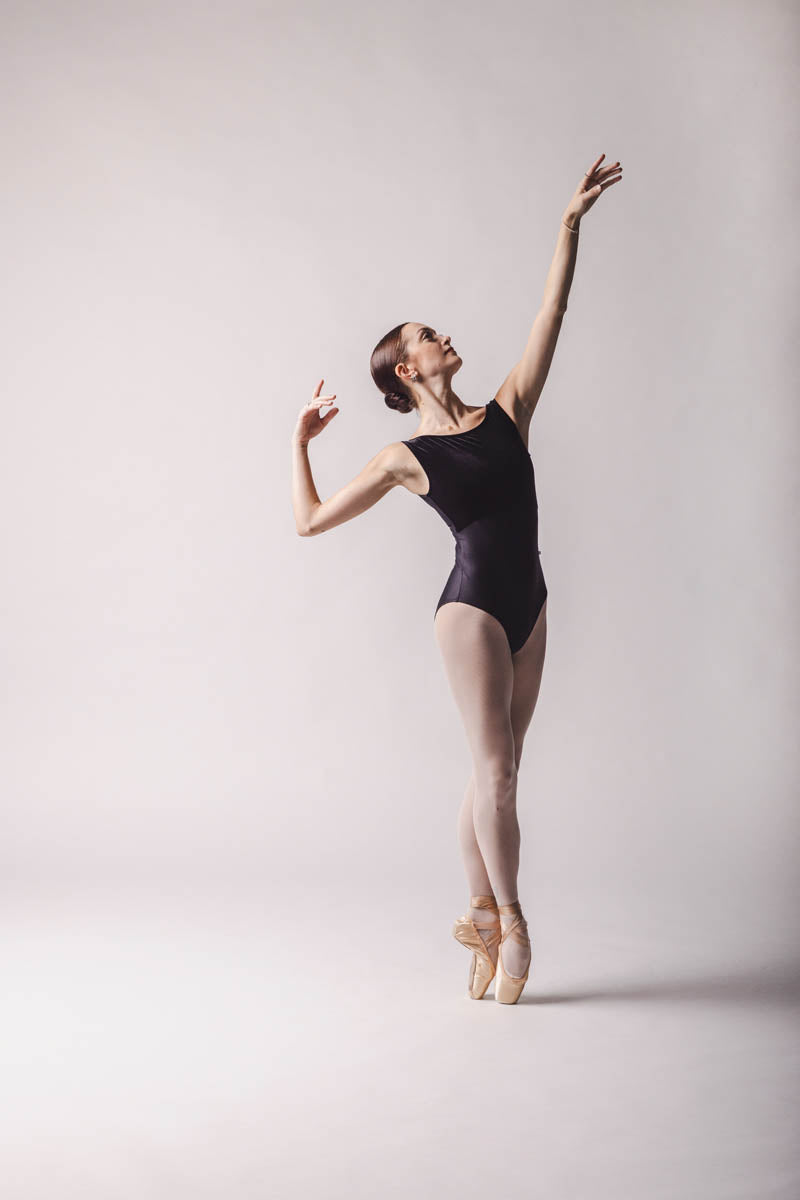 Claire Leotard, Color: Black  Features a sleek and contouring design, a velour bust panel and boat neck, V-back and a tank silhouette. By worldwide Ballet