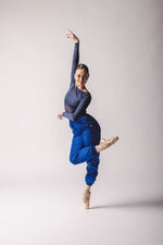 the dancer wearing  Trashbag Pants, color: Royal Blue, perfect warm up pants, on top: crop top royal blue in By worldwide Ballet