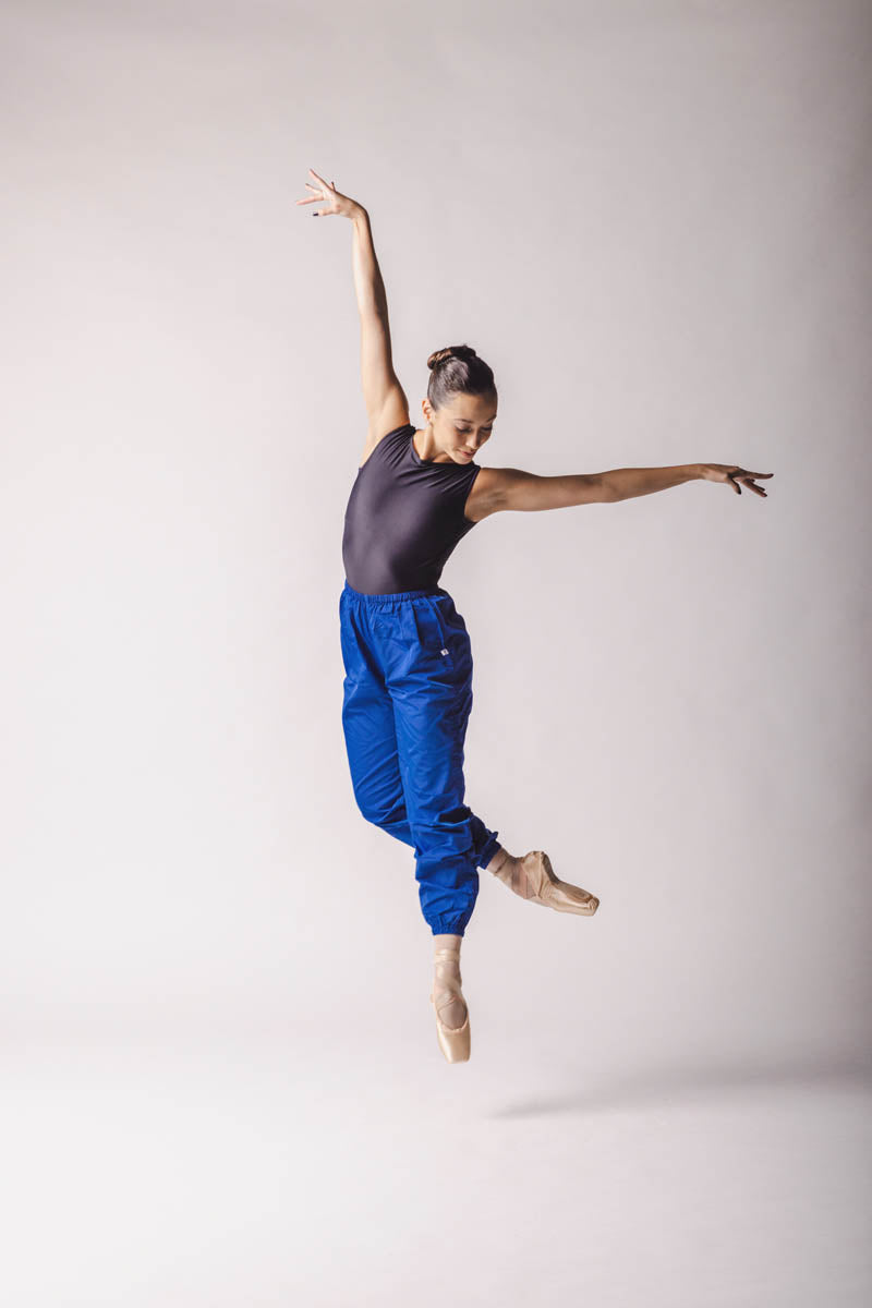 The dancer is wearing Trashbag Pants, color: Royal Blue, By worldwide Ballet