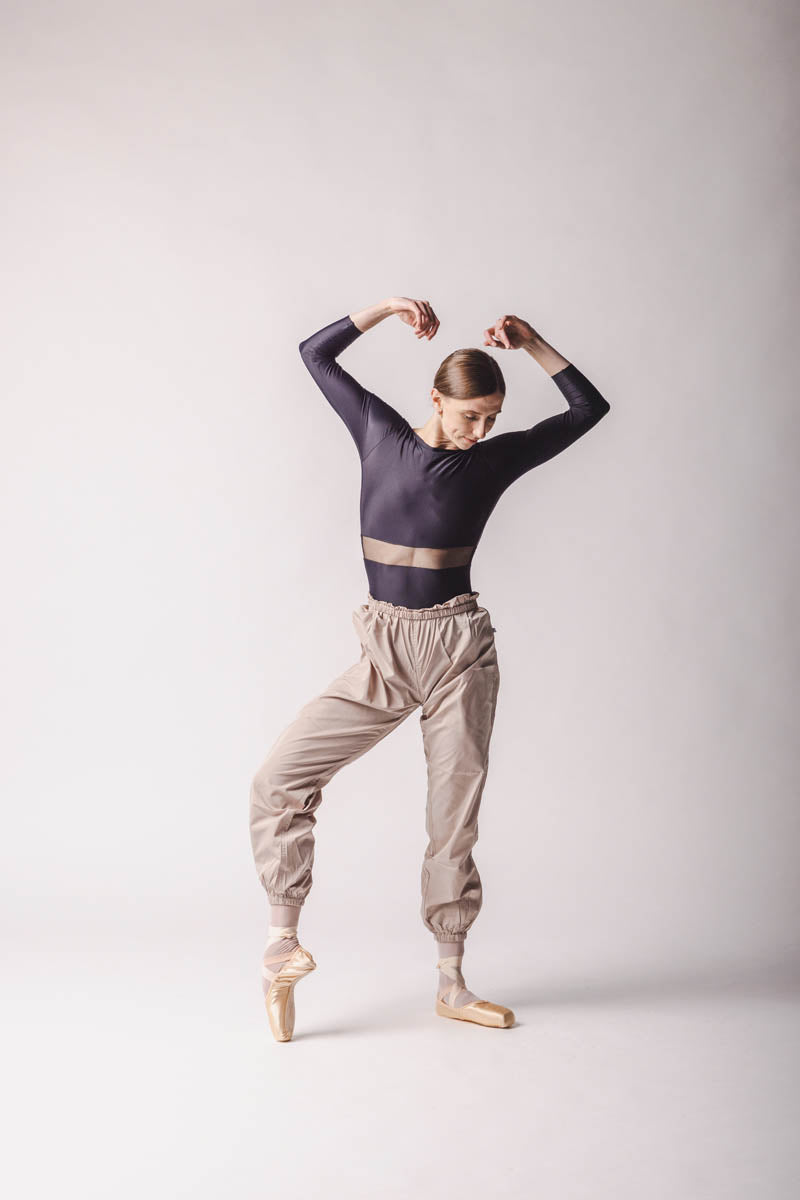Elle is wearing Beige Trashbag Pants, perfect warm up pants, By worldwide Ballet