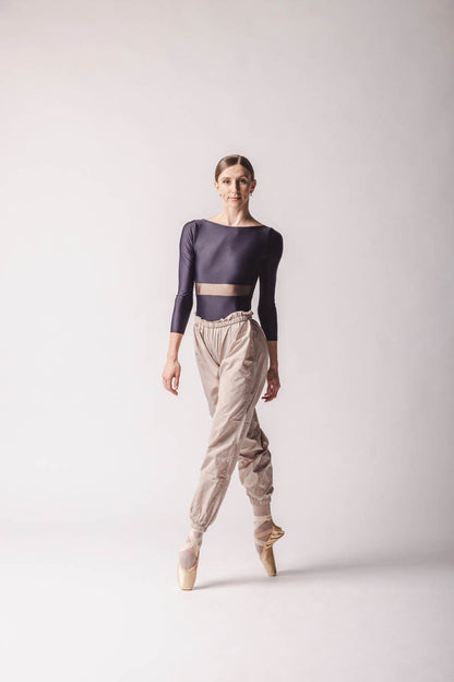 Elle is wearing Beige Trashbag Pants, perfect warm up pants, By worldwide Ballet