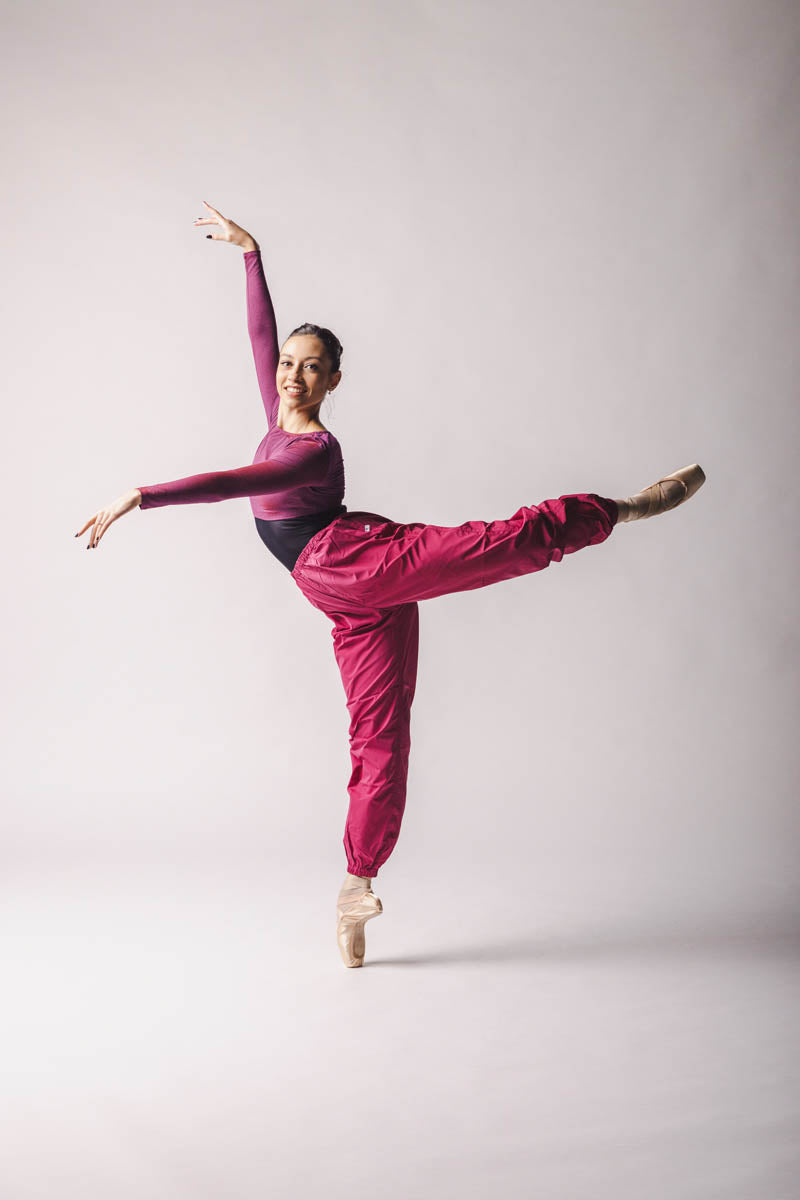 The dancer is wearing Crop Top color: Rich Fuchsia By worldwide Ballet