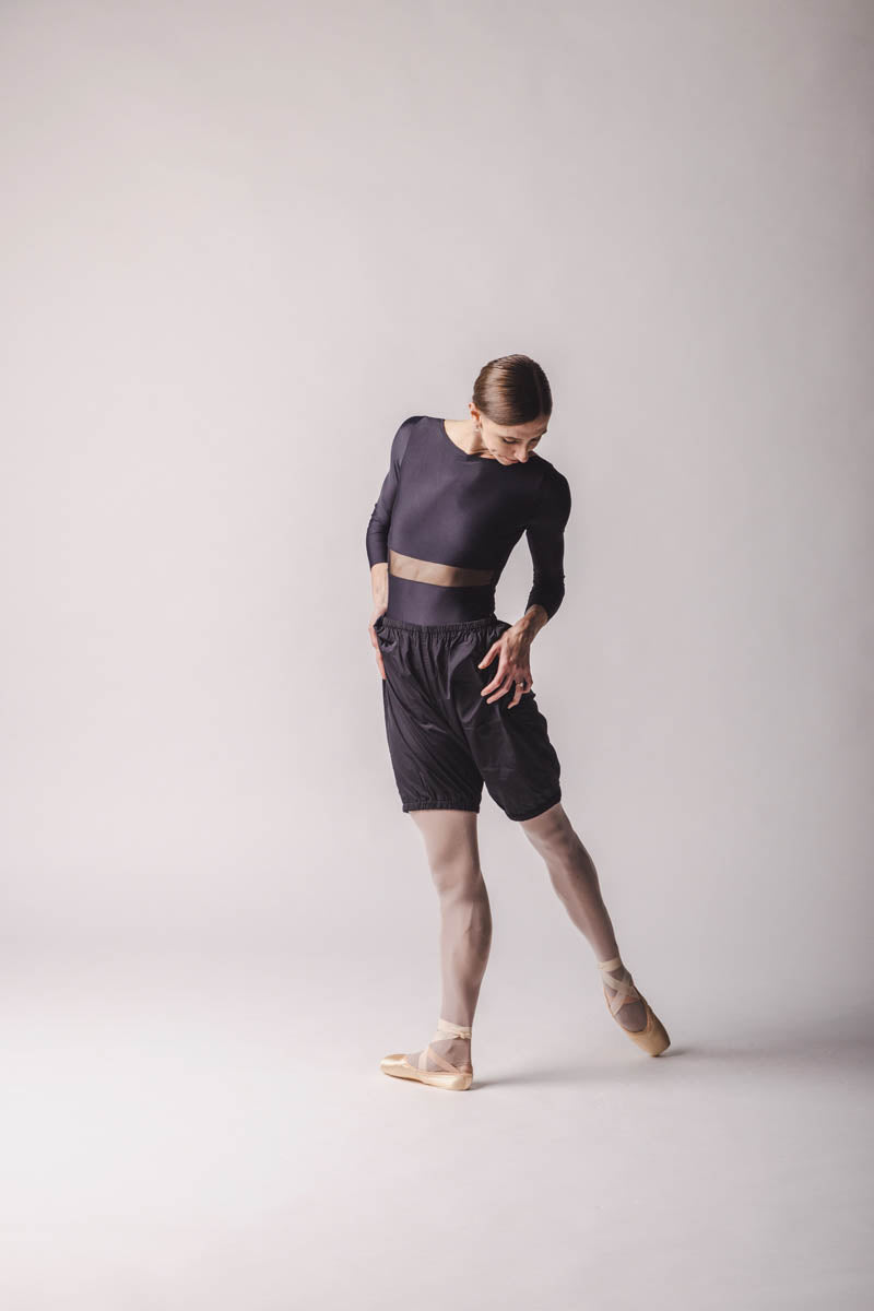 The dancer is wearing shorts trashbag pants in Black, by worldwide ballet