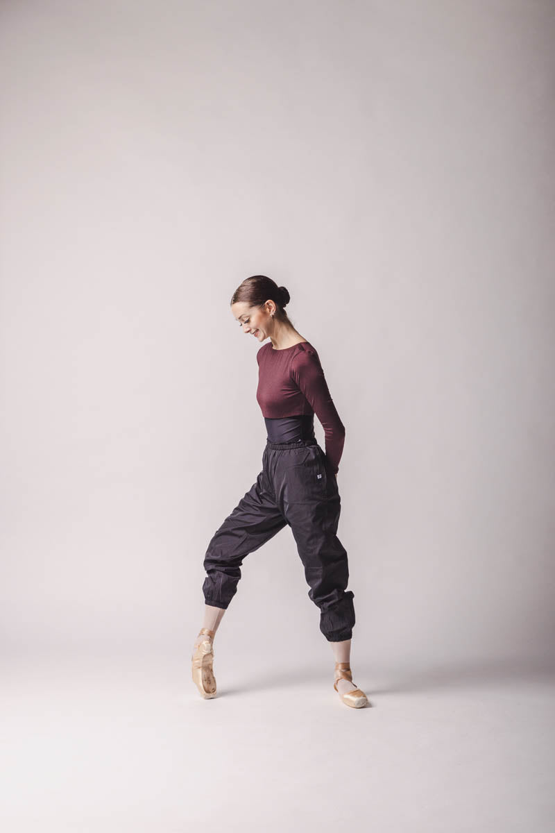 The dancer is wearing Crop Top color: Burgundy By worldwide Ballet