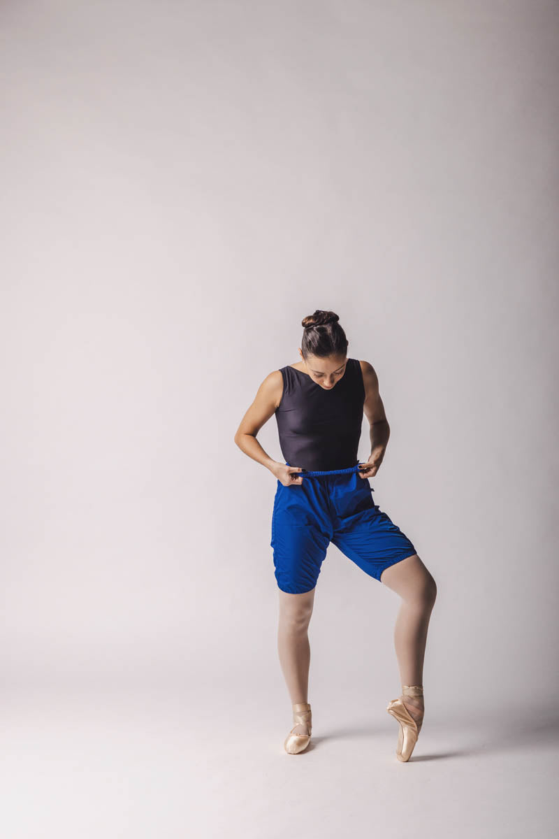 The dancer is wearing shorts trashbag pants in Royal Blue, by worldwide ballet