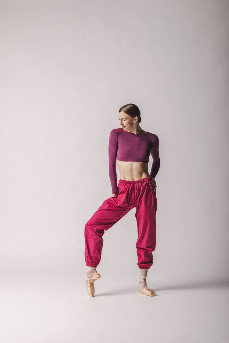 The dancer is wearing Crop Top color: Rich Fuchsia By worldwide Ballet