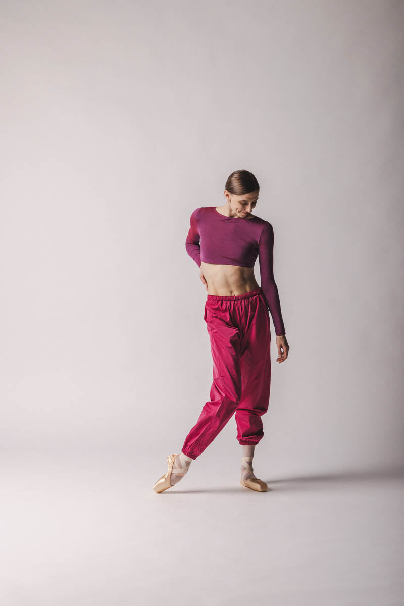 The dancer is wearing Crop Top color: Rich Fuchsia By worldwide Ballet